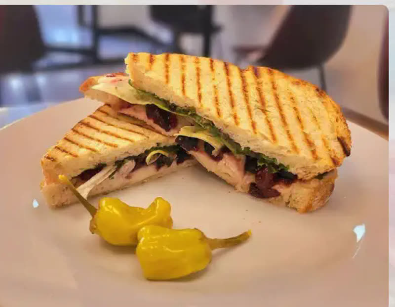 Pressed sandwich with pepperoncini at Cafe Time