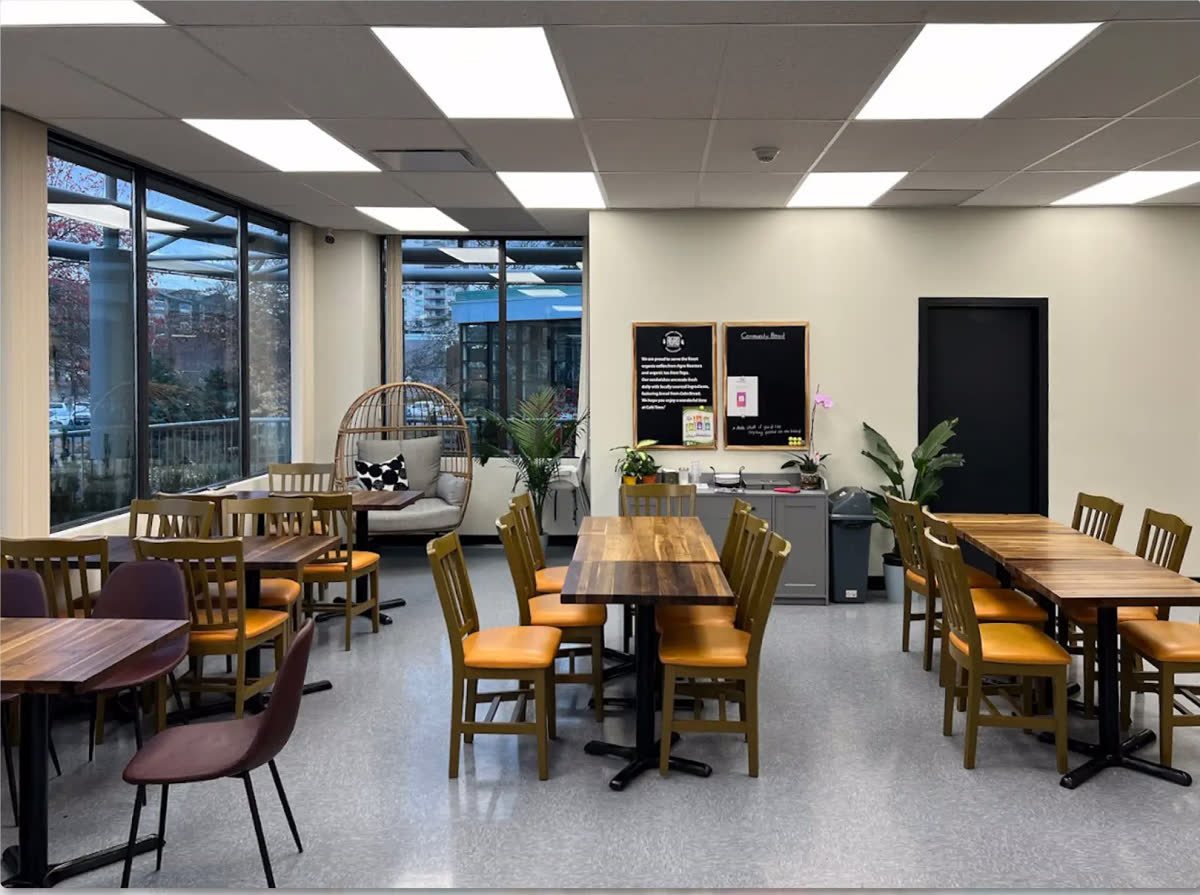 Inside Cafe Time, natural light and wood tables